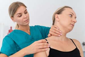 physiotherapist-helping-patient-her-clinic (1)