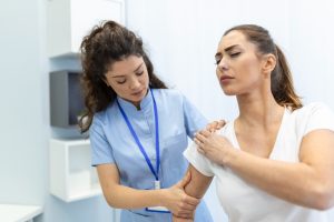 woman-doctor-osteopath-medical-uniform-fixing-woman-patients-shoulder-back-joints-manual-therapy-clinic-visit-professional-osteopath-work-with-patient-concept (1)